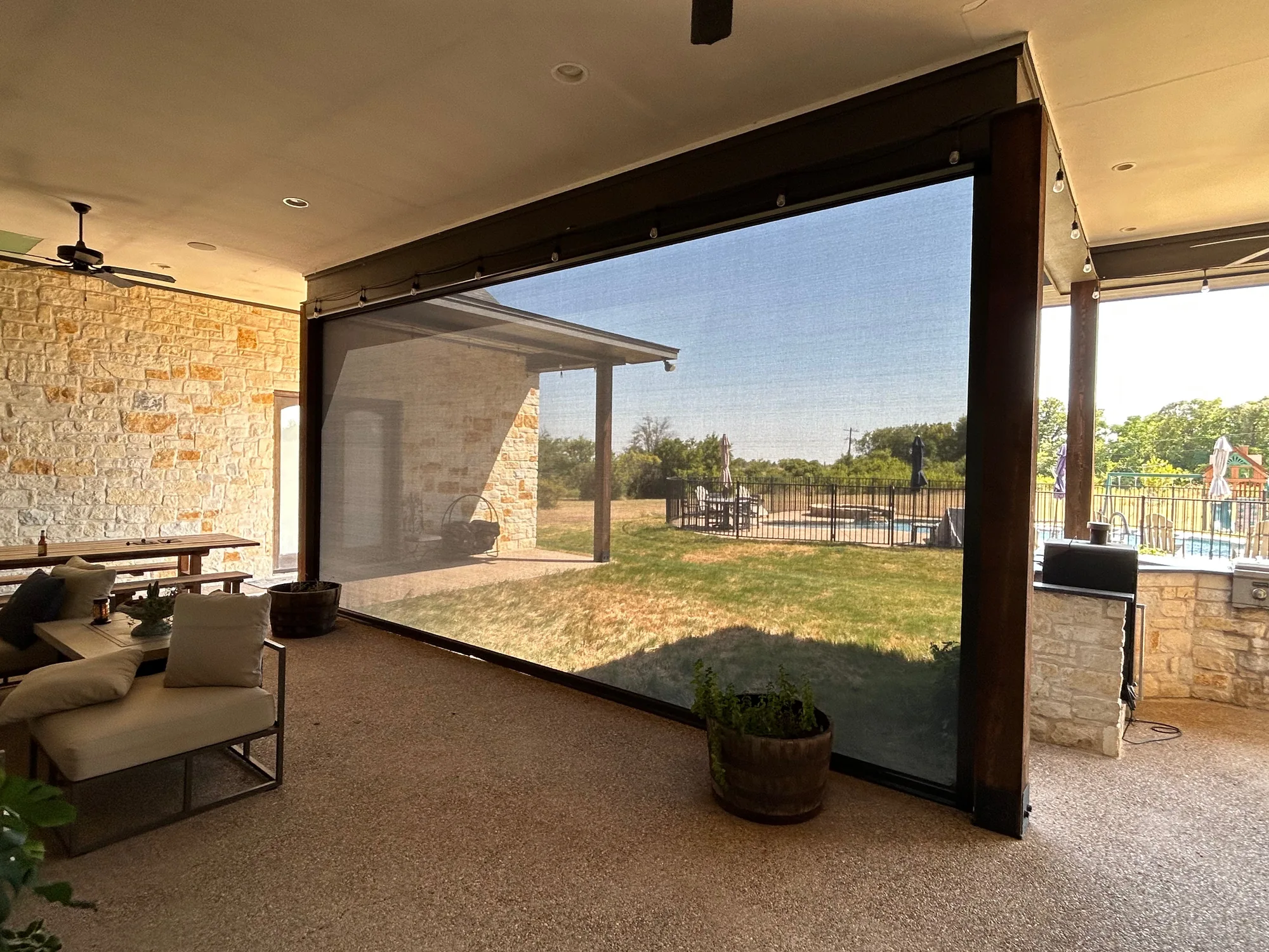 Exterior Patio Shades fitted to the window opening by Love Is Blinds
