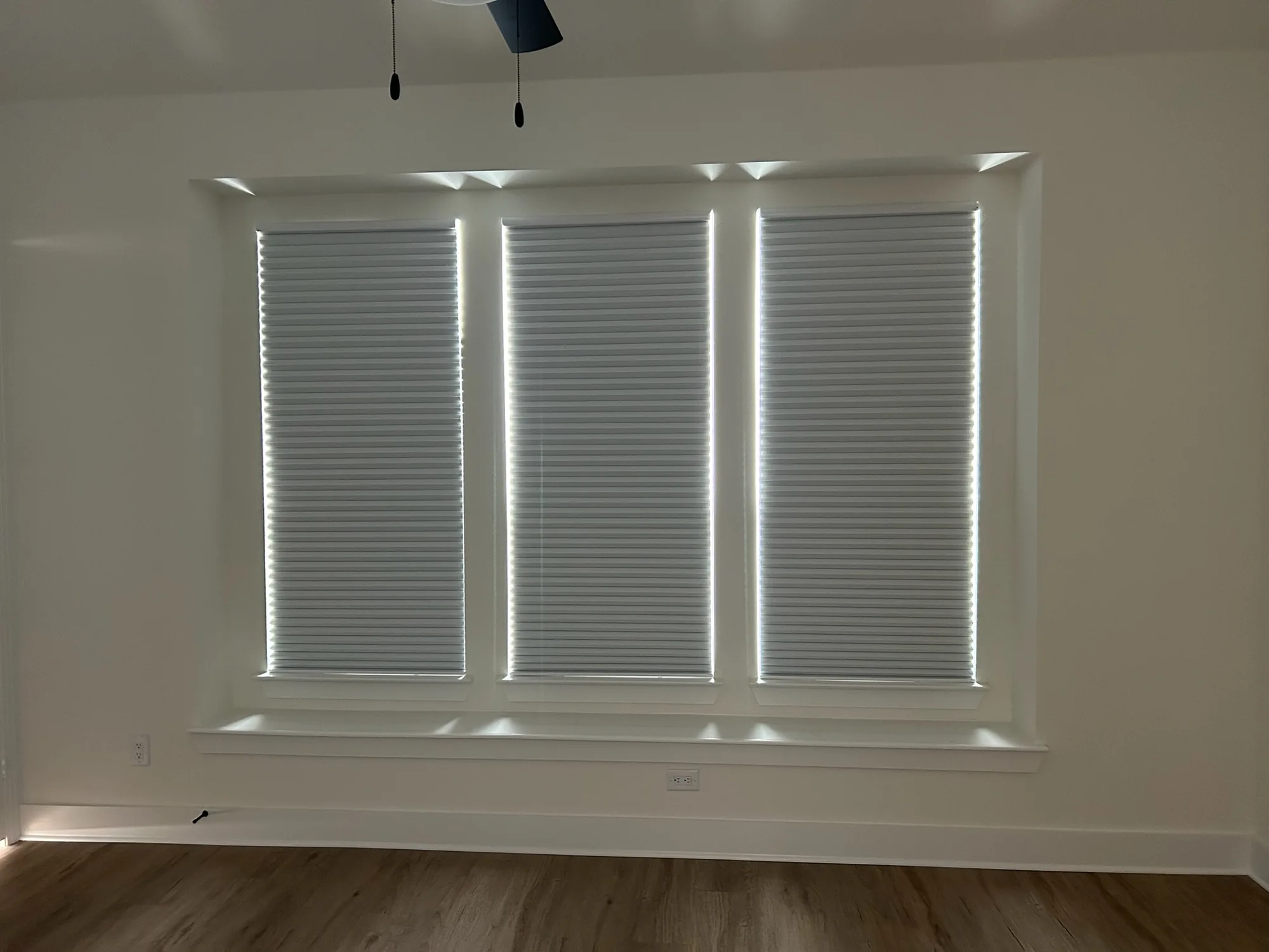 Honeycomb shades installed by Love Is Blinds in a Texas home