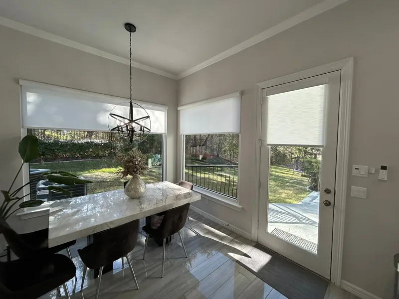 Roller shades in a sunny Texas dining room