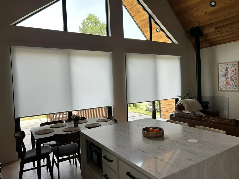 Roller shades across an open Texas kitchen