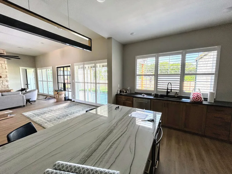 Plantation shutters in an open Texas kitchen