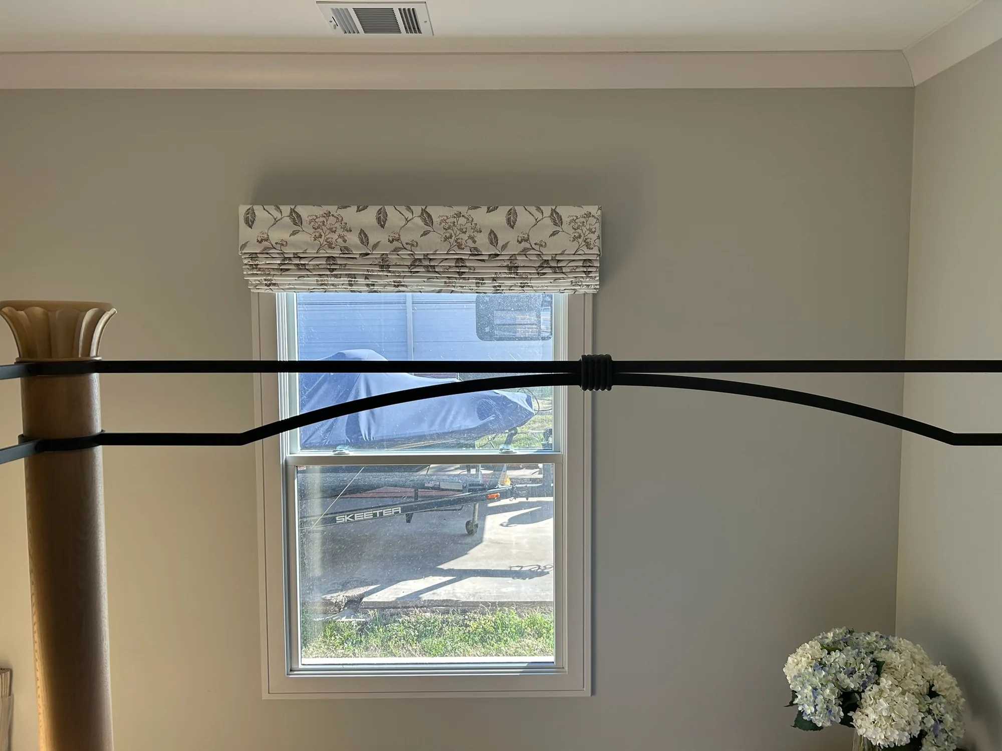 Roman & Woven across a bright Texas window wall