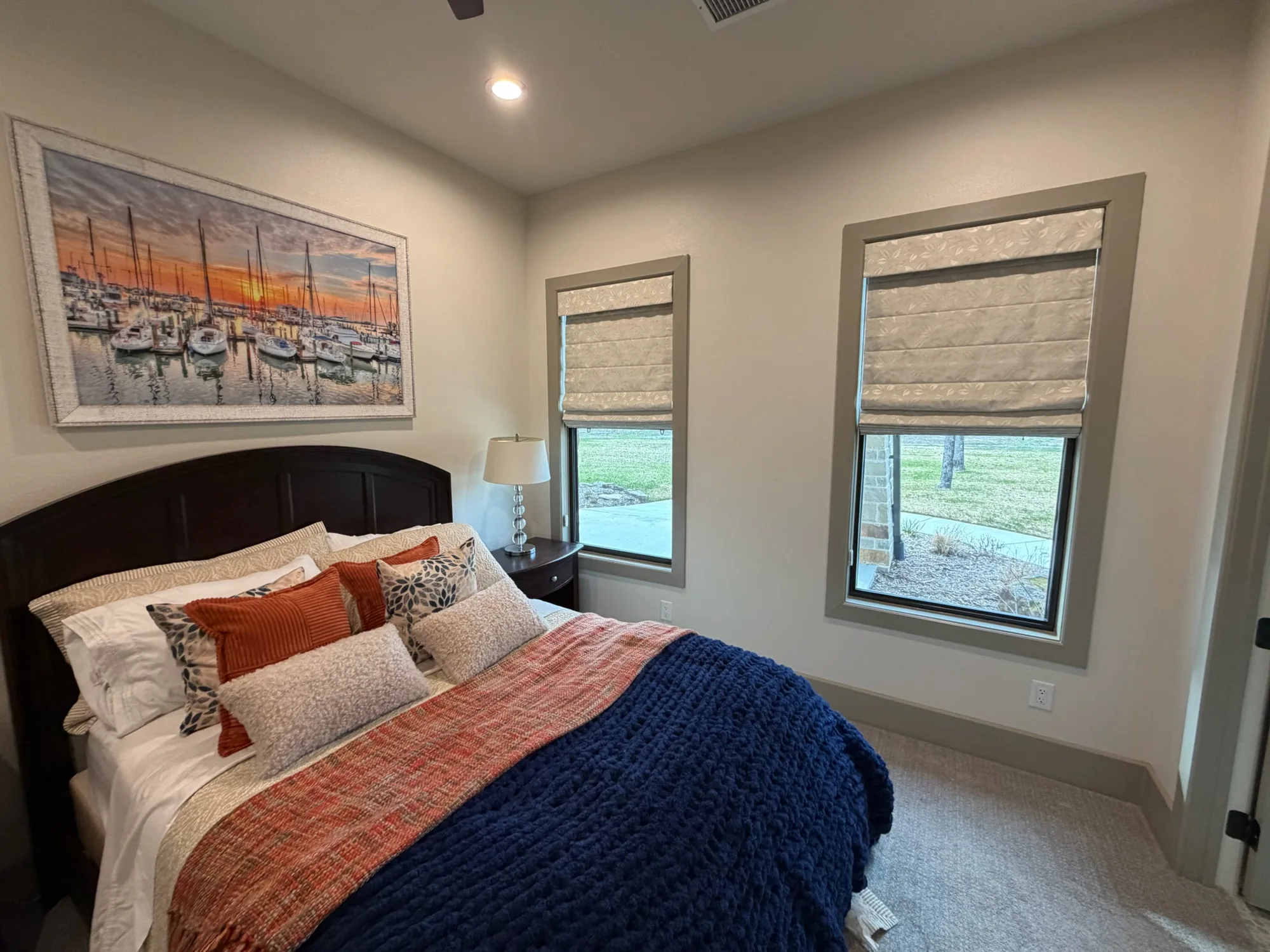 Roman & Woven across a bright Texas window wall