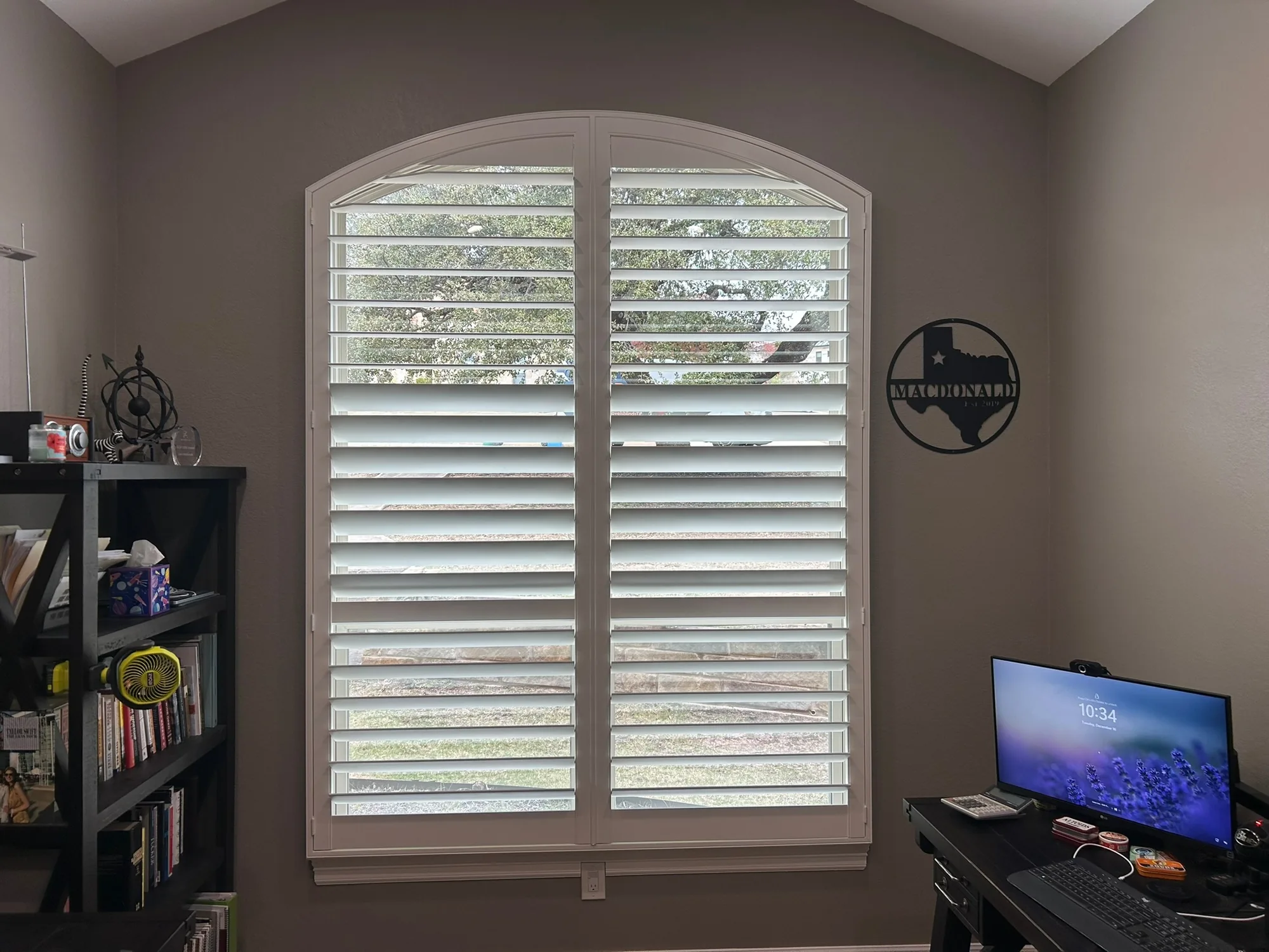 Plantation Shutters across a bright Texas window wall