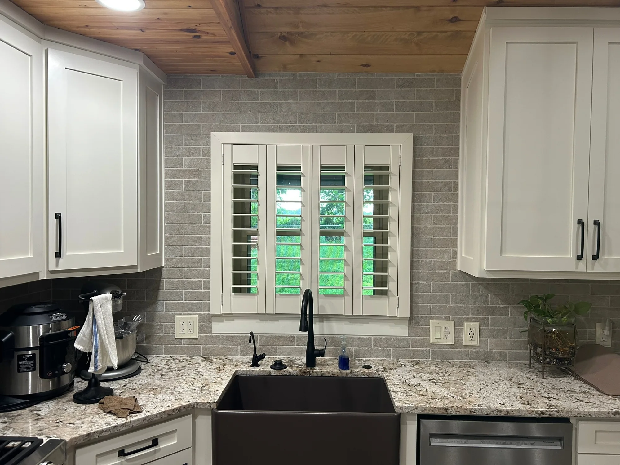 Custom window treatments across a wide Texas window, installed by Love Is Blinds