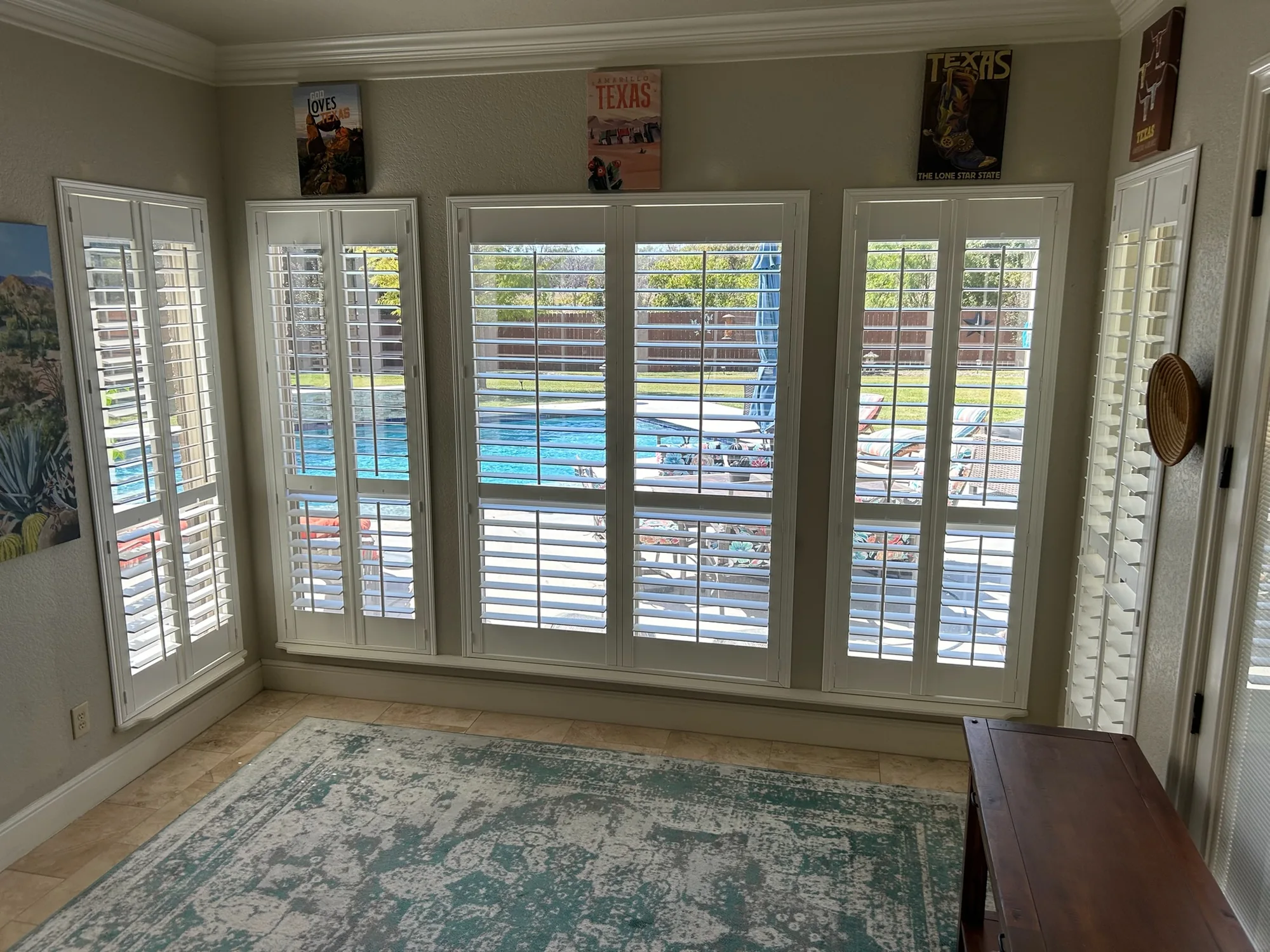 Plantation Shutters across a bright Texas window wall